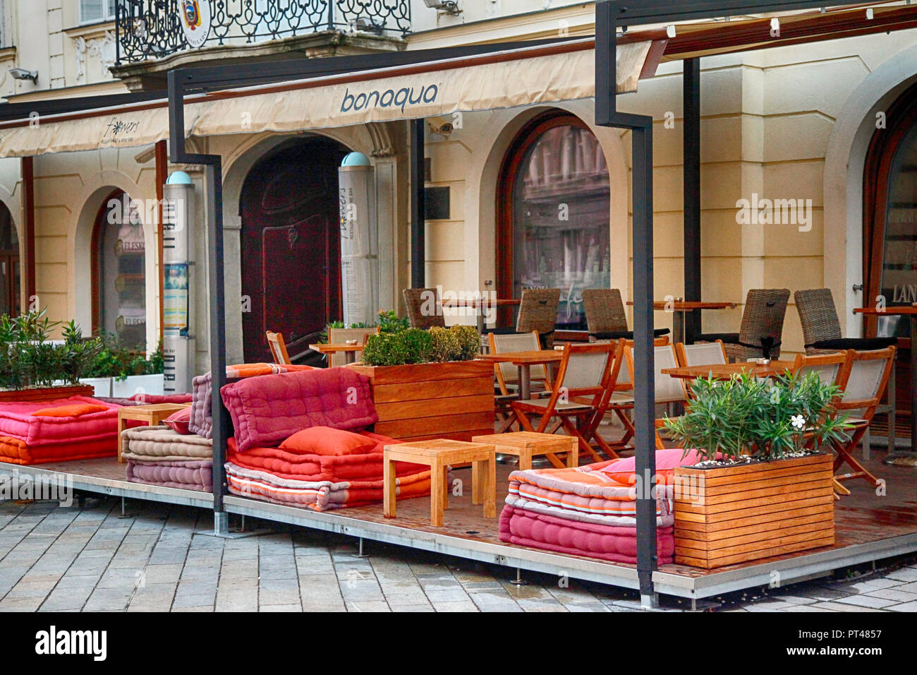 The inviting, outdoor seating patio of the the trendy Flowers restaurant, awaits it's patrons for the evening in the heart of Bratislava, Slovakia Stock Photo