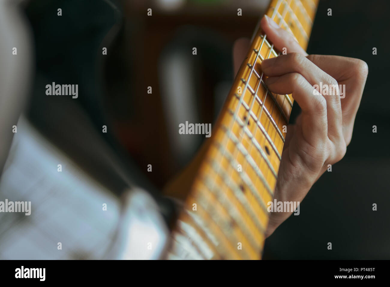 Guitarist playing electric guitar Stock Photo