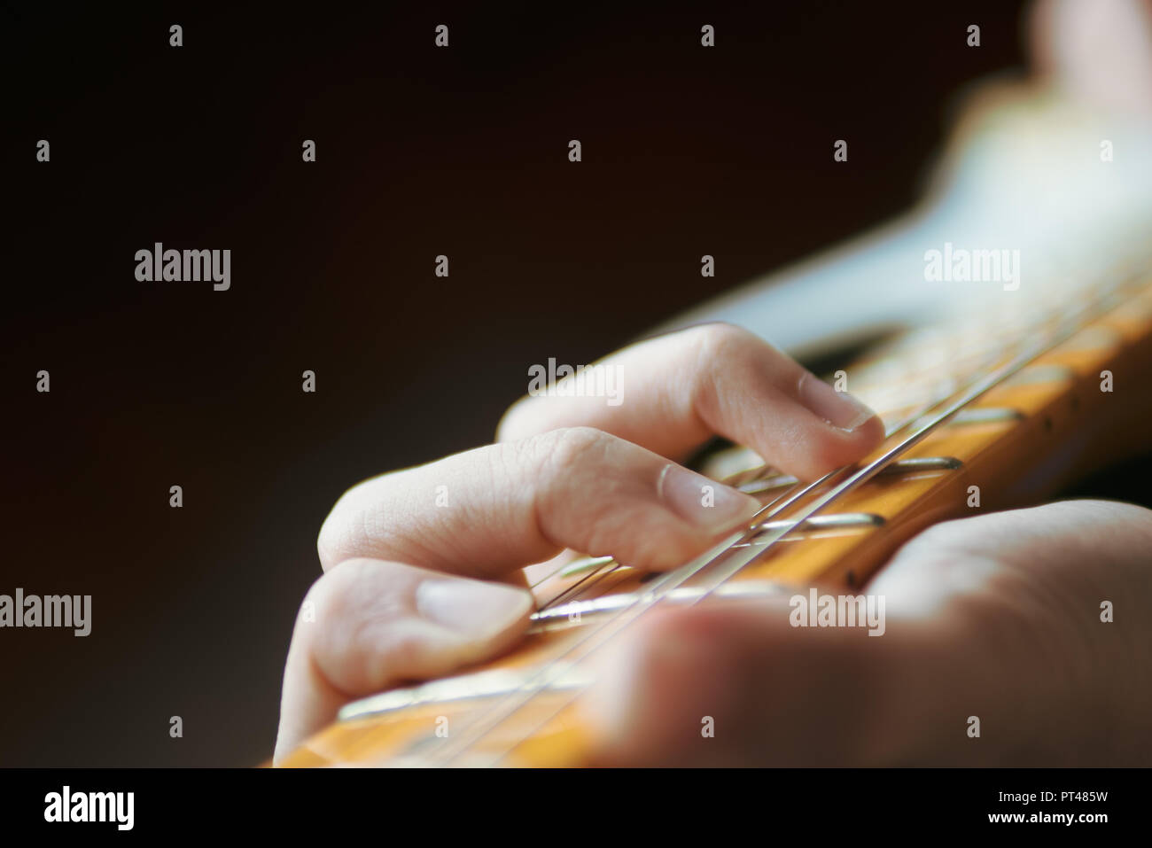 Guitarist playing electric guitar Stock Photo