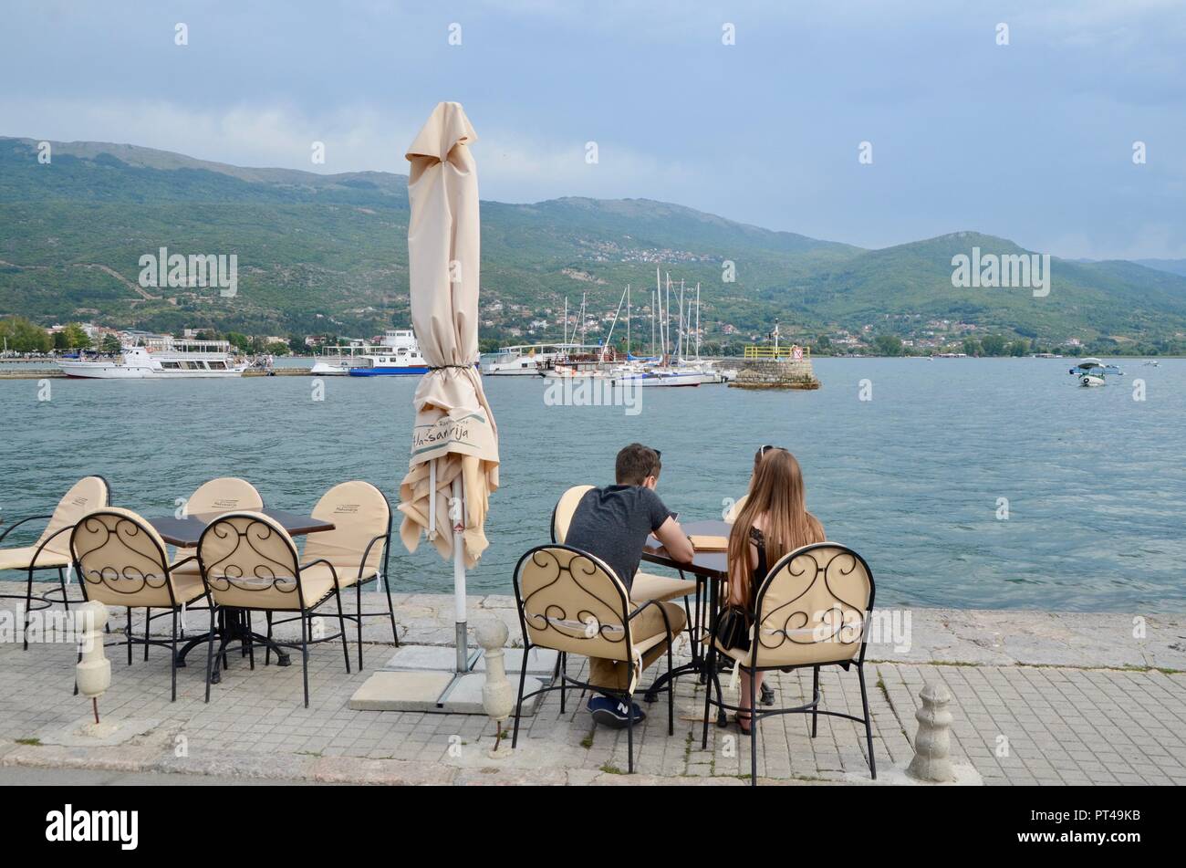 people relax at a cafe next to lake ohrid macedonia Stock Photo