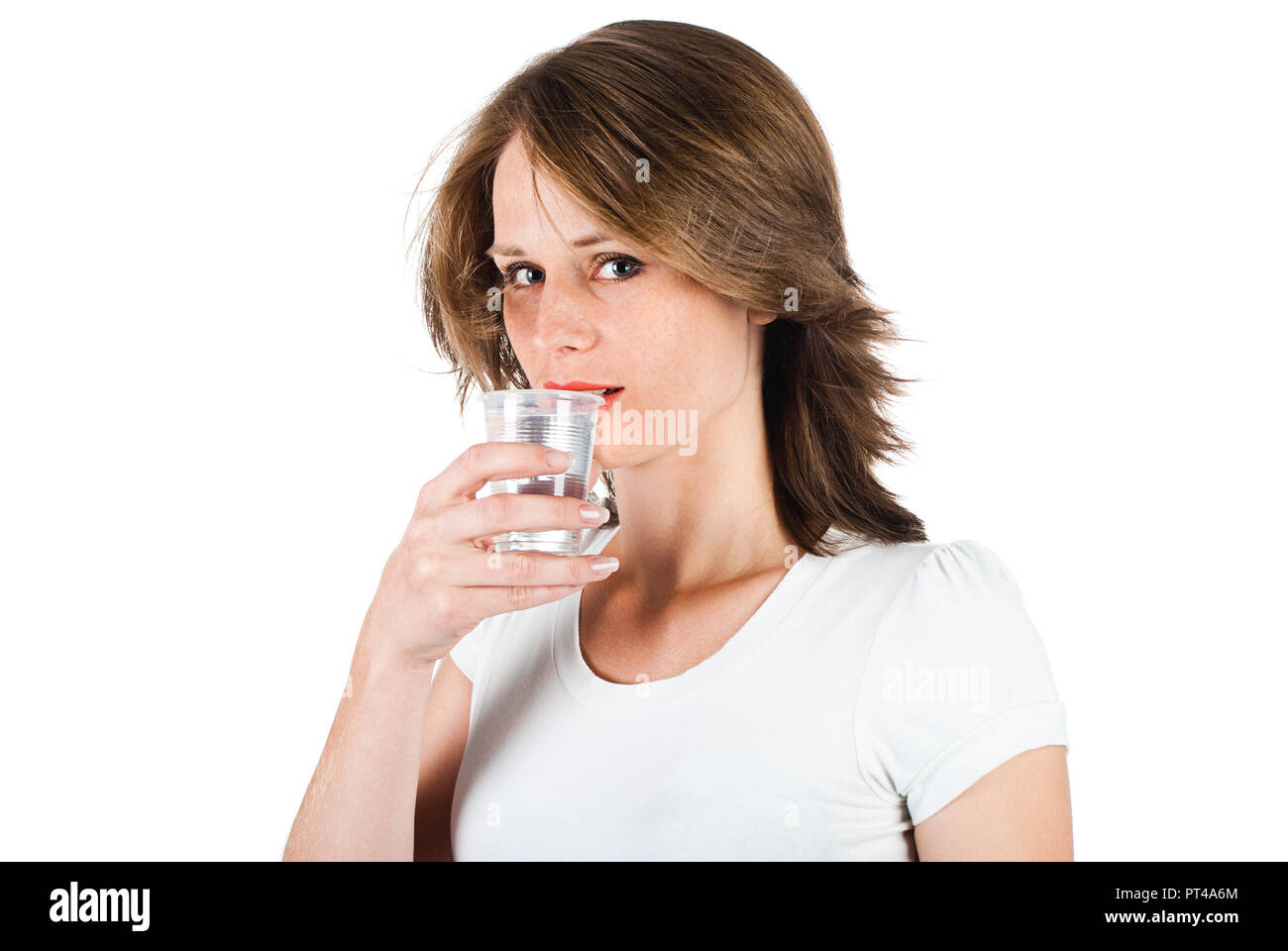 woman drinking water from plastic cup, isolated on a white