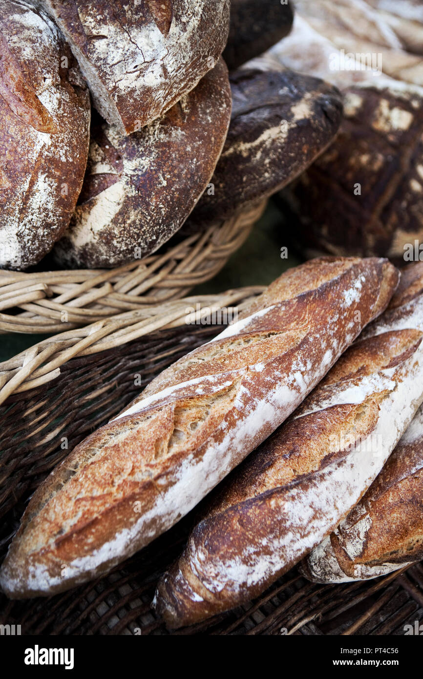 French rustic and crispy breads in wicker baskets Stock Photo - Alamy
