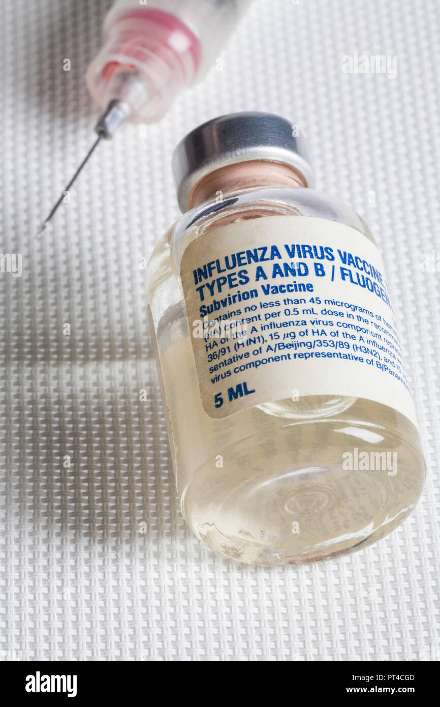 Close up of  flu vaccine vial and hypodermic needle, USA Stock Photo