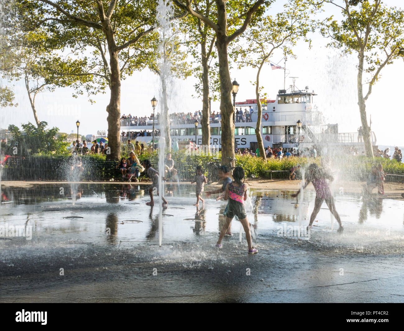 Bosque Fountain in Battery Park with Statue of Liberty Ferry in