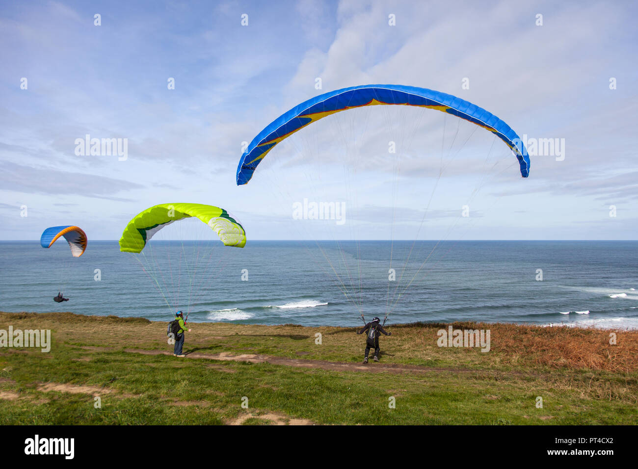 paragliding flight at the edge of the coast Stock Photo