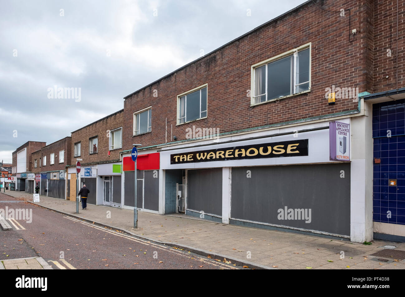 A complete or whole street boarded up in Crewe town centre Cheshire UK Stock Photo