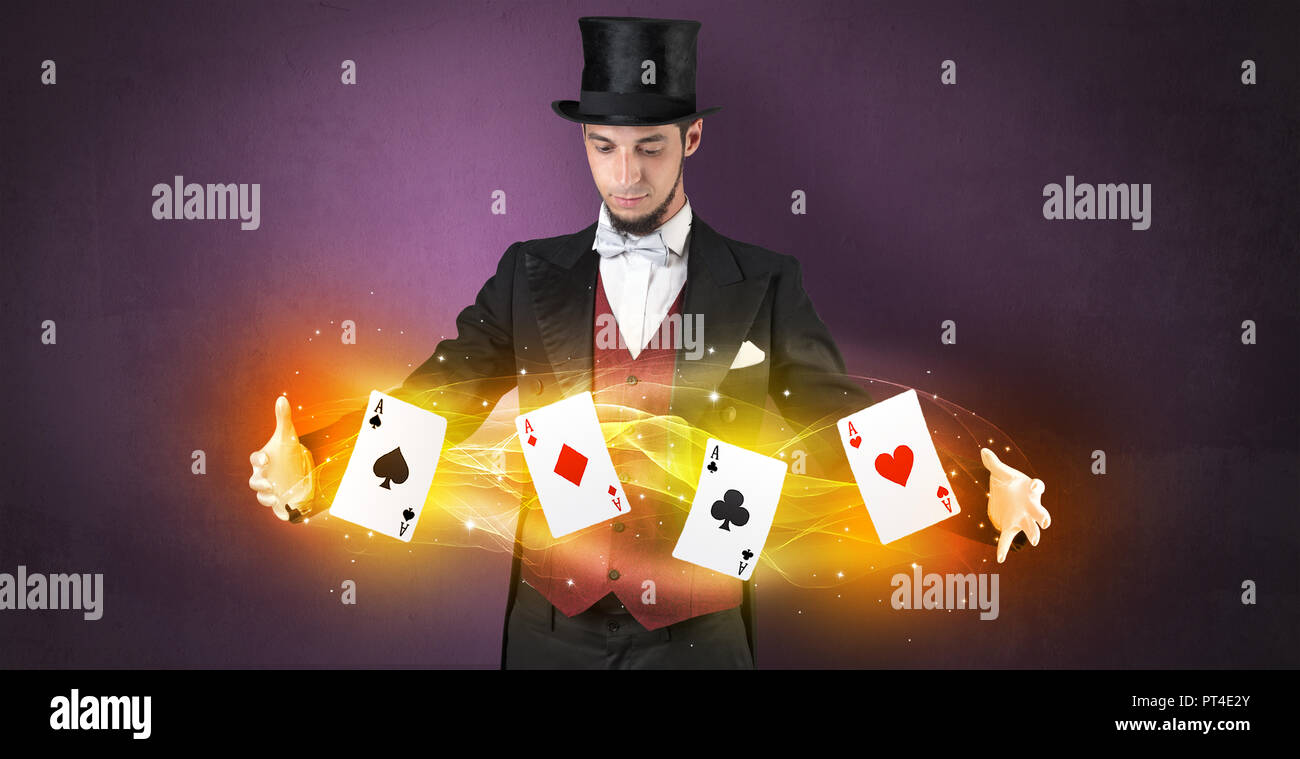 Illusionist in tails bandy play cards between his two hands Stock Photo ...