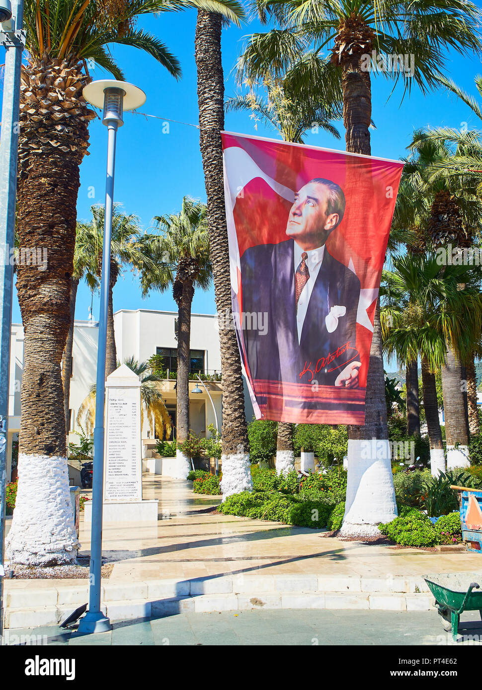 Bodrum, Turkey - July 6, 2018. Mustafa Kemal Ataturk flag in a square of Bodrum downtown. Mugla Province, Turkey. Stock Photo