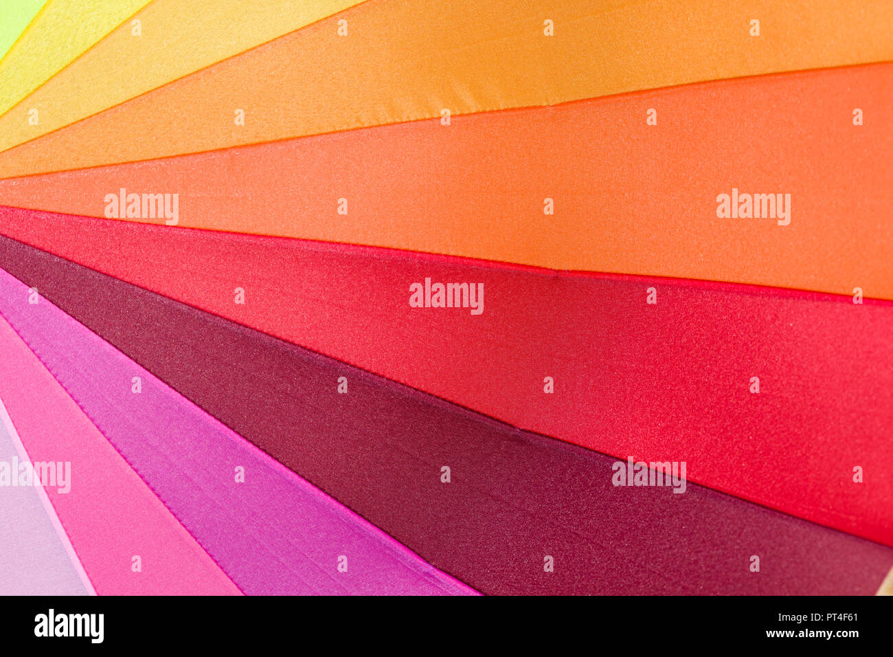 Abstract geometric triangle pattern in bright rainbow multiple colors Stock Photo