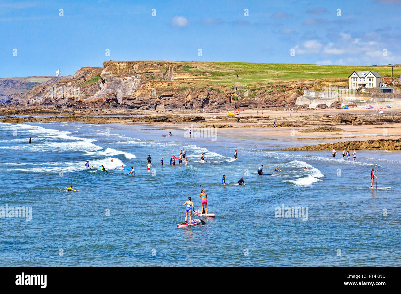 6 July 2018: Bude, Cornwall, UK - Crowds cooling off in the sea during the summer heatwave. Stock Photo