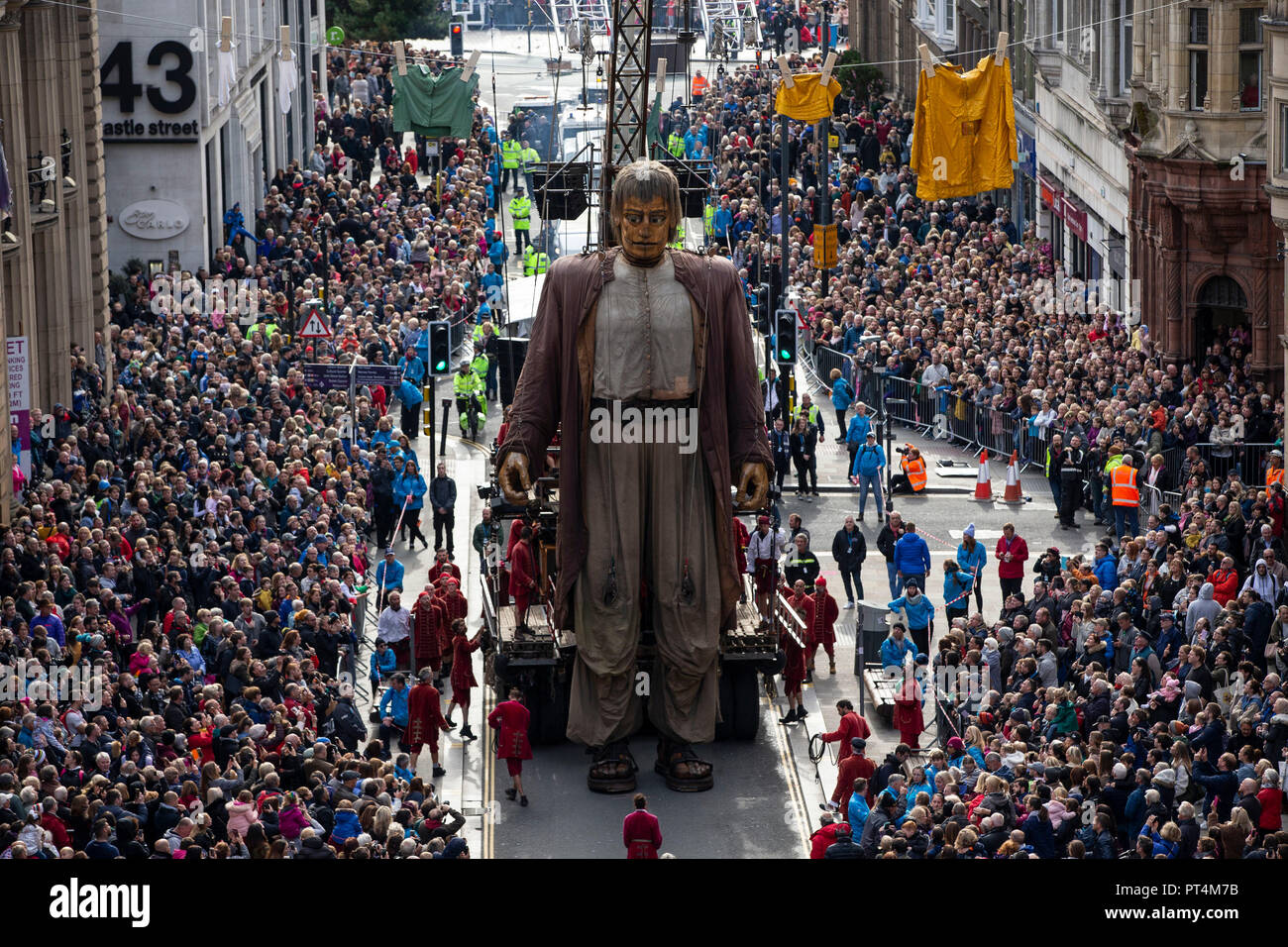 The Royal De Luxe theatre company's 'Giants' street puppet, The Giant Man, during a street theatre performance in Liverpool. Stock Photo