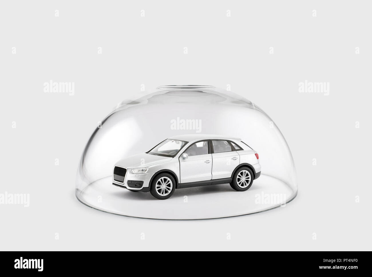 Modern silver car protected under a glass dome Stock Photo