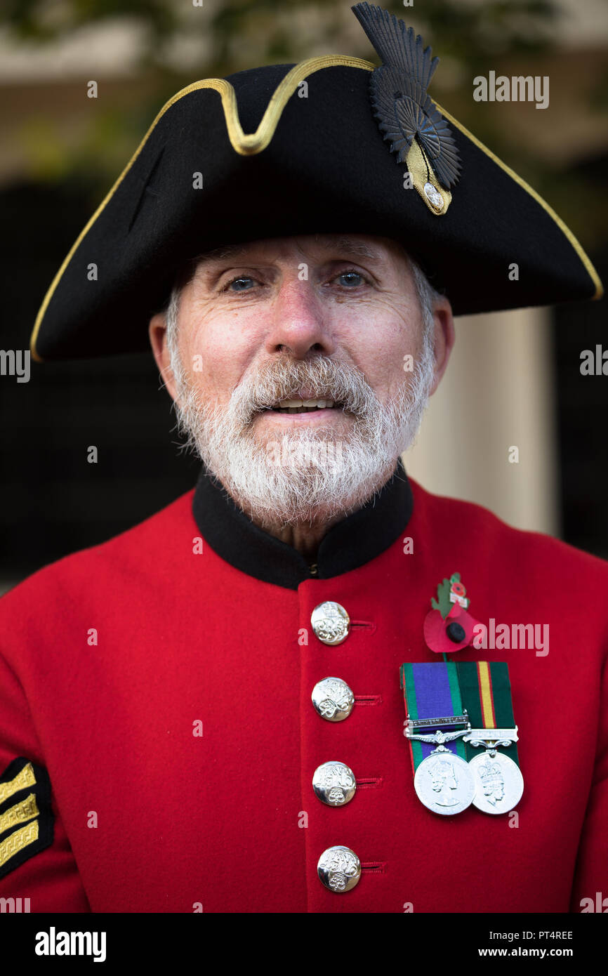 Chelsea Pensioner wearing his red uniform and medals at the Remembrance Day Parade, London. Stock Photo