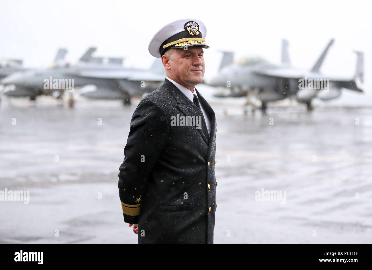 Rear Admiral Eugene H. 'Gene' Black, Commander, Carrier Strike Group 8, on board the US Nimitz-class aircraft carrier USS Harry S. Truman, following its arrival into Stokes bay, Hampshire, during a visit to Portsmouth. Stock Photo