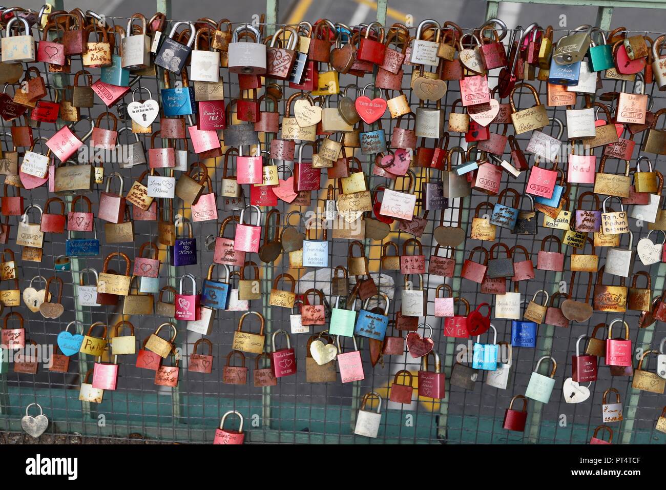 love locks fixed onto bridge railing Stock Photo