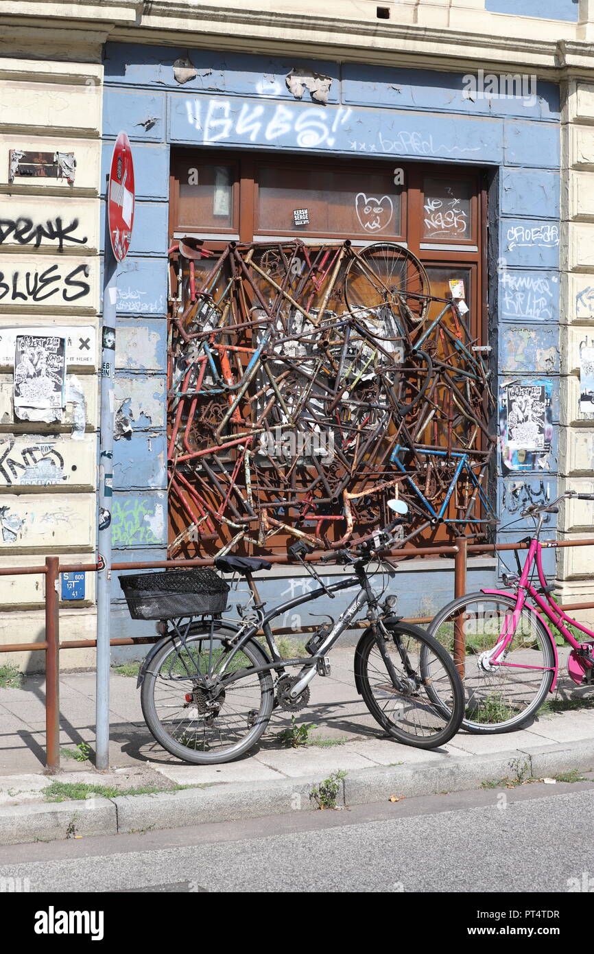 Rusty bikes forming a window decoration Stock Photo