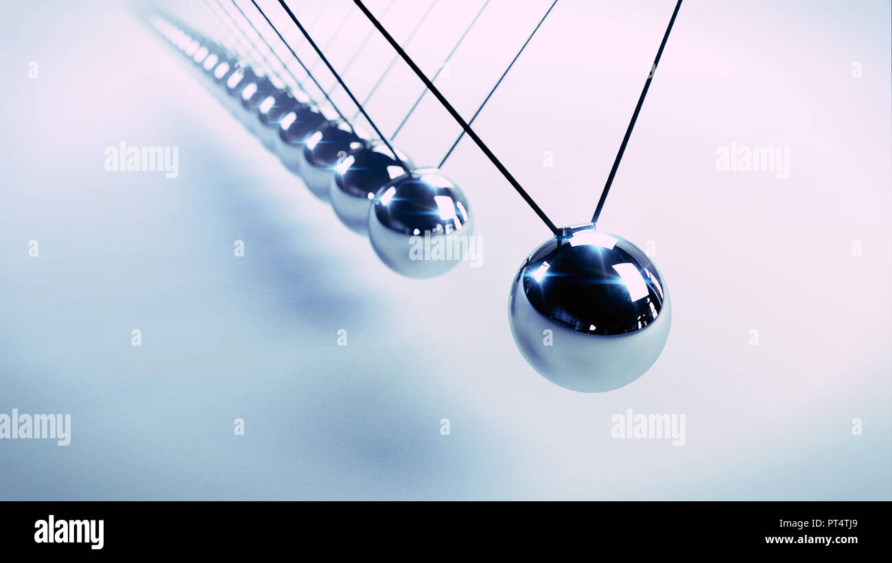 Newton's cradle, action and reaction concept, series of swinging spheres, device that demonstrates conservation of momentum and energy Stock Photo