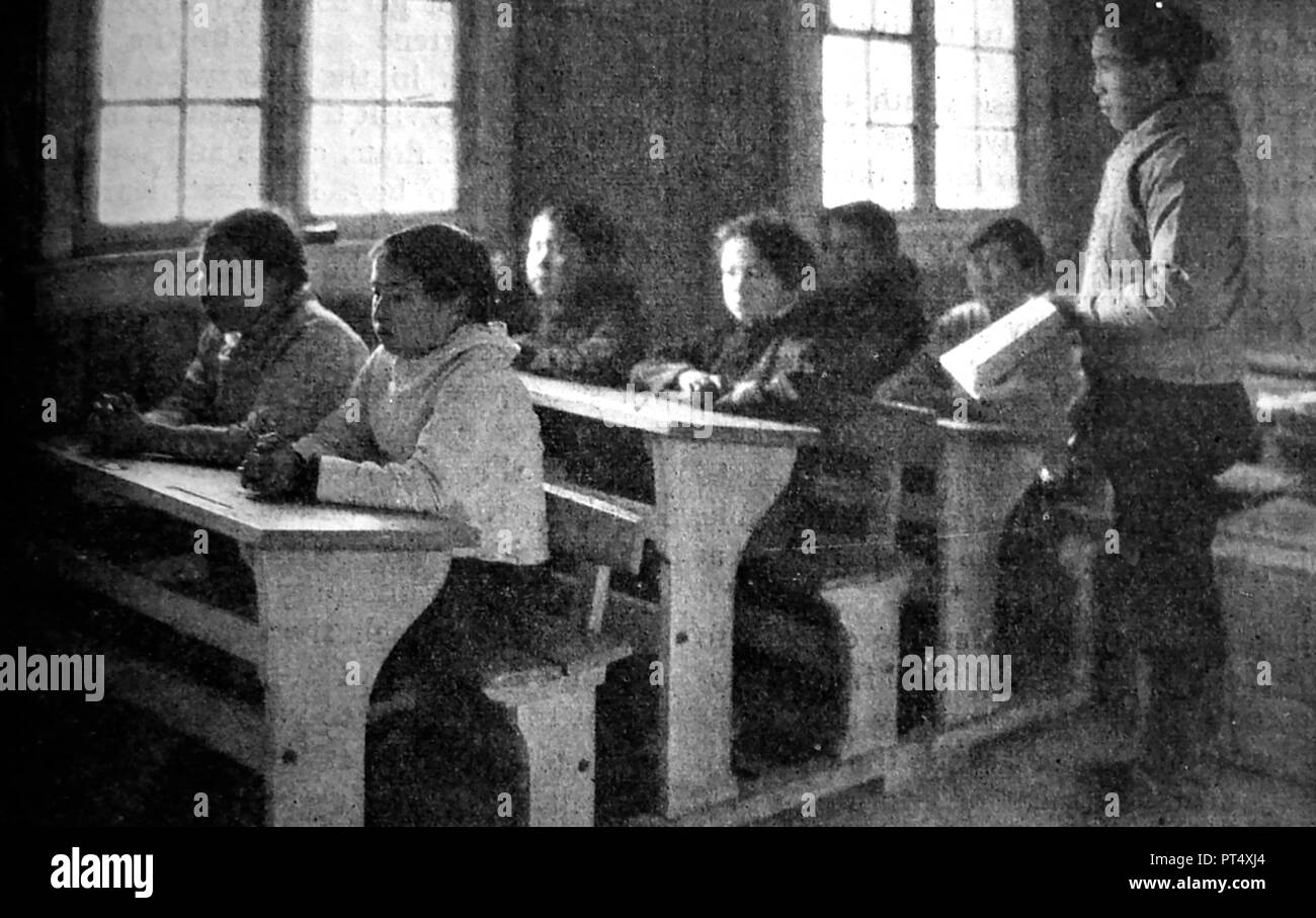 EDUCATION - A newspaper photograph of schoolchildren in school in Greenland, circa 1940's Stock Photo