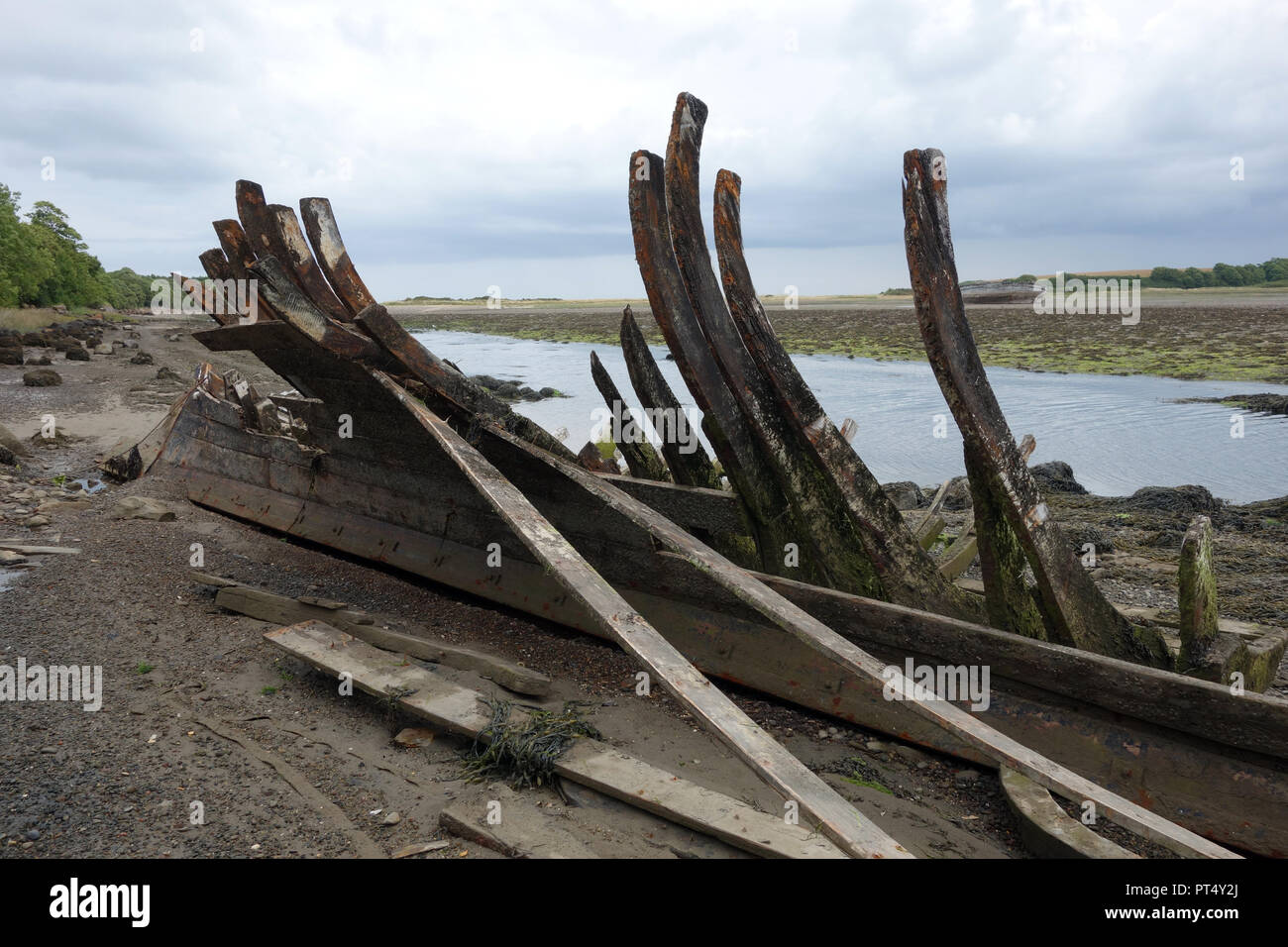 old-wooden-ship-wreck-on-the-sands-in-the-estuary-at-traeth-dulas-on