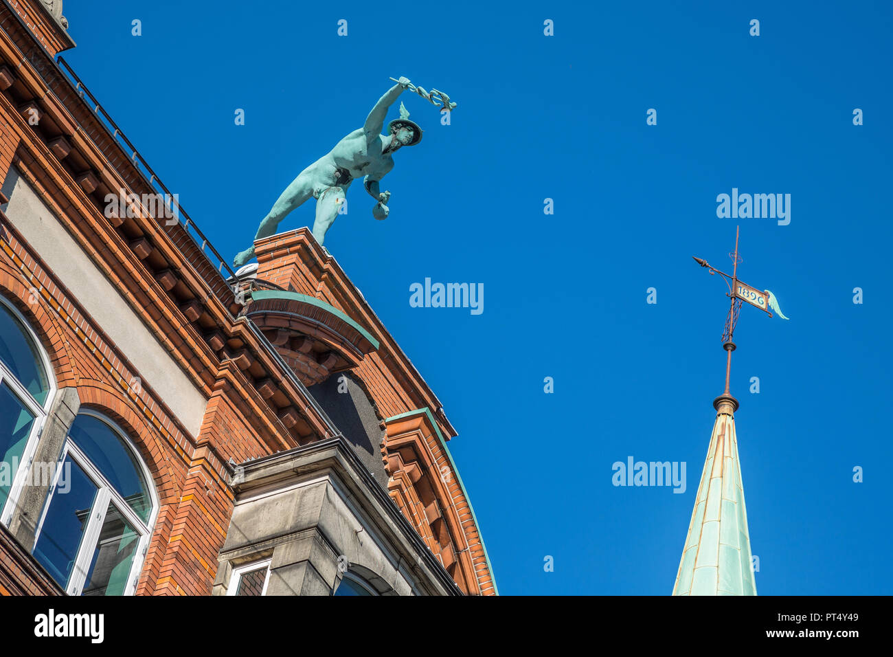Mercury statue staggered in the blue sky, copenhagen, denmark Stock Photo
