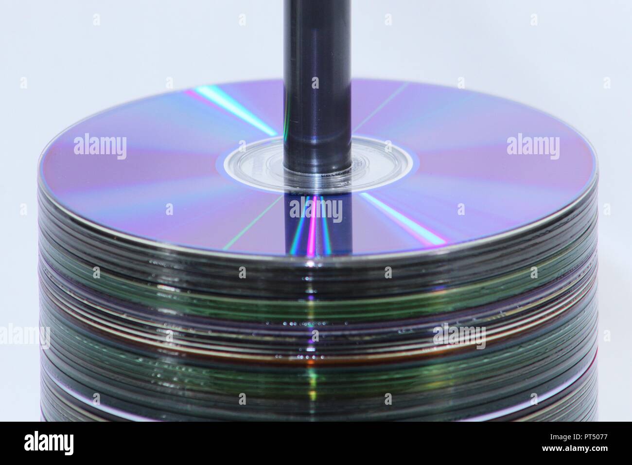 Spool of CD's stacked in the center of the frame Stock Photo - Alamy