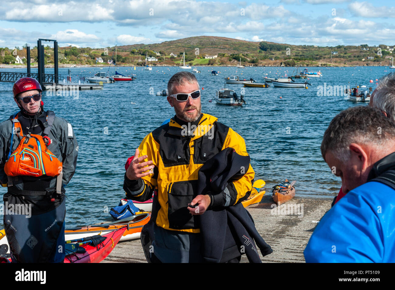 Schull, West Cork, Ireland. 6th Oct, 2018.  On a beautiful day in West Cork, a kayak instructor gives instructions before Association members paddle out into Schull Harbour. Today's activities culminate this evening in a dinner dance at the Schull Harbour Hotel. Credit: Andy Gibson/Alamy Live News. Stock Photo