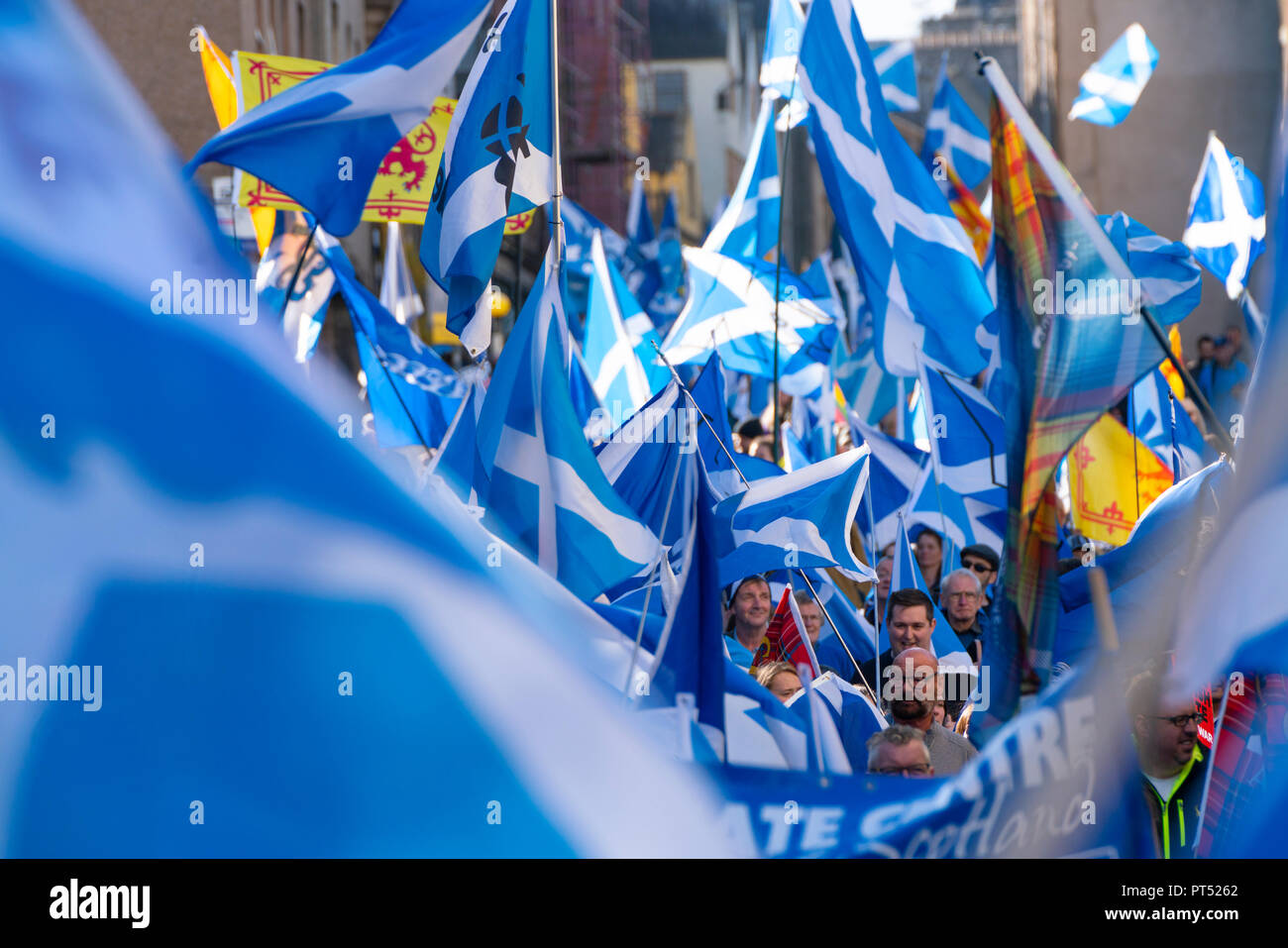 Edinburgh, Scotland, United Kingdom, 7th October 2018. All Under One Banner (AUOB) Scottish March and Rally for Independence. Pro- Scottish independence  supporters walking from Edinburgh Castle to the Scottish Parliament at Holyrood. AOUB is a pro-independence organisation. Credit: Iain Masterton/Alamy Live News Stock Photo