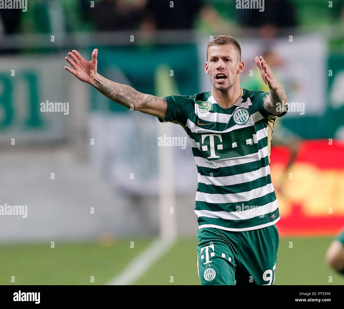 BUDAPEST, HUNGARY - JULY 12: (r-l) Roland Varga of Ferencvarosi TC hugs  goal scorer Stefan