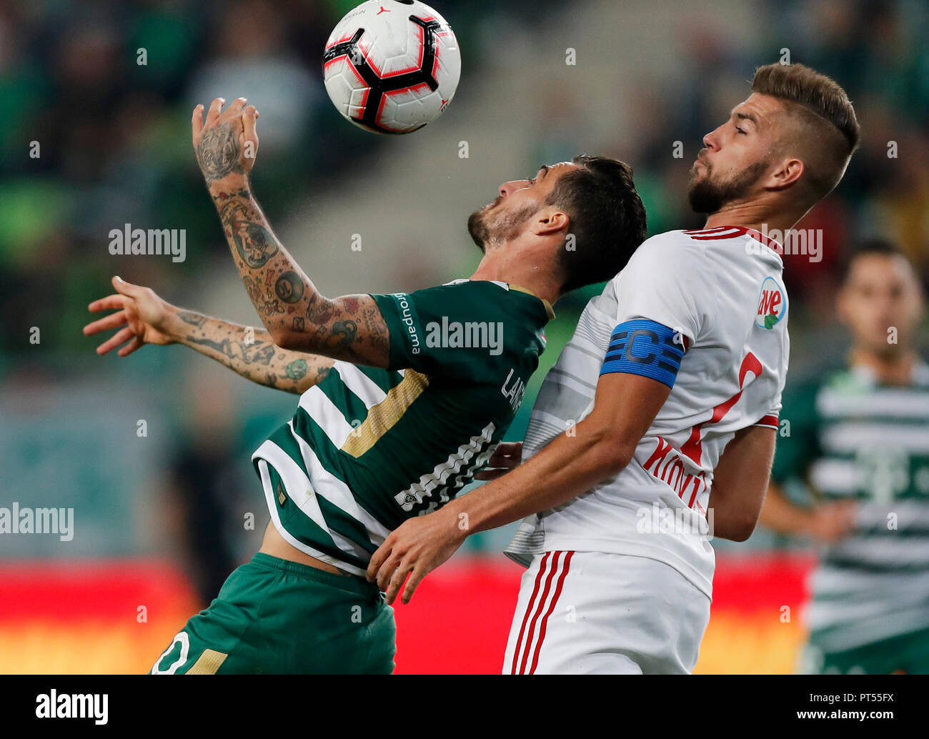 BUDAPEST, HUNGARY - OCTOBER 6: (l-r) Davide Lanzafame of Ferencvarosi TC battles for the ball in the air with Akos Kinyik of DVSC during the Hungarian OTP Bank Liga match between Ferencvarosi TC and DVSC at Groupama Arena on October 6, 2018 in Budapest, Hungary. Credit: Laszlo Szirtesi/Alamy Live News Stock Photo