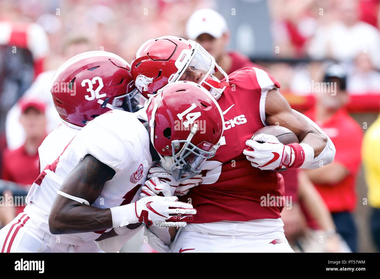 Oct 6, 2018: Alabama defenders Dylan Moses #32 and Deionte Thompson #14 lay a hit on Arkansas running back Rakeem Boyd #5. Alabama defeated Arkansas 65-31 at Donald W. Reynolds Stadium in Fayetteville, AR, Richey Miller/CSM Stock Photo