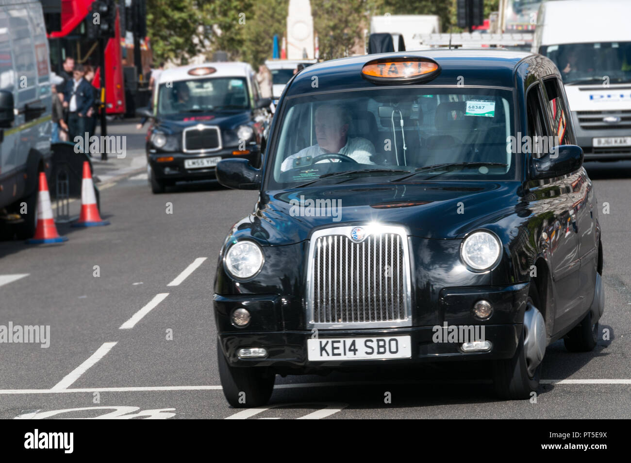 UK taxi in London street Stock Photo