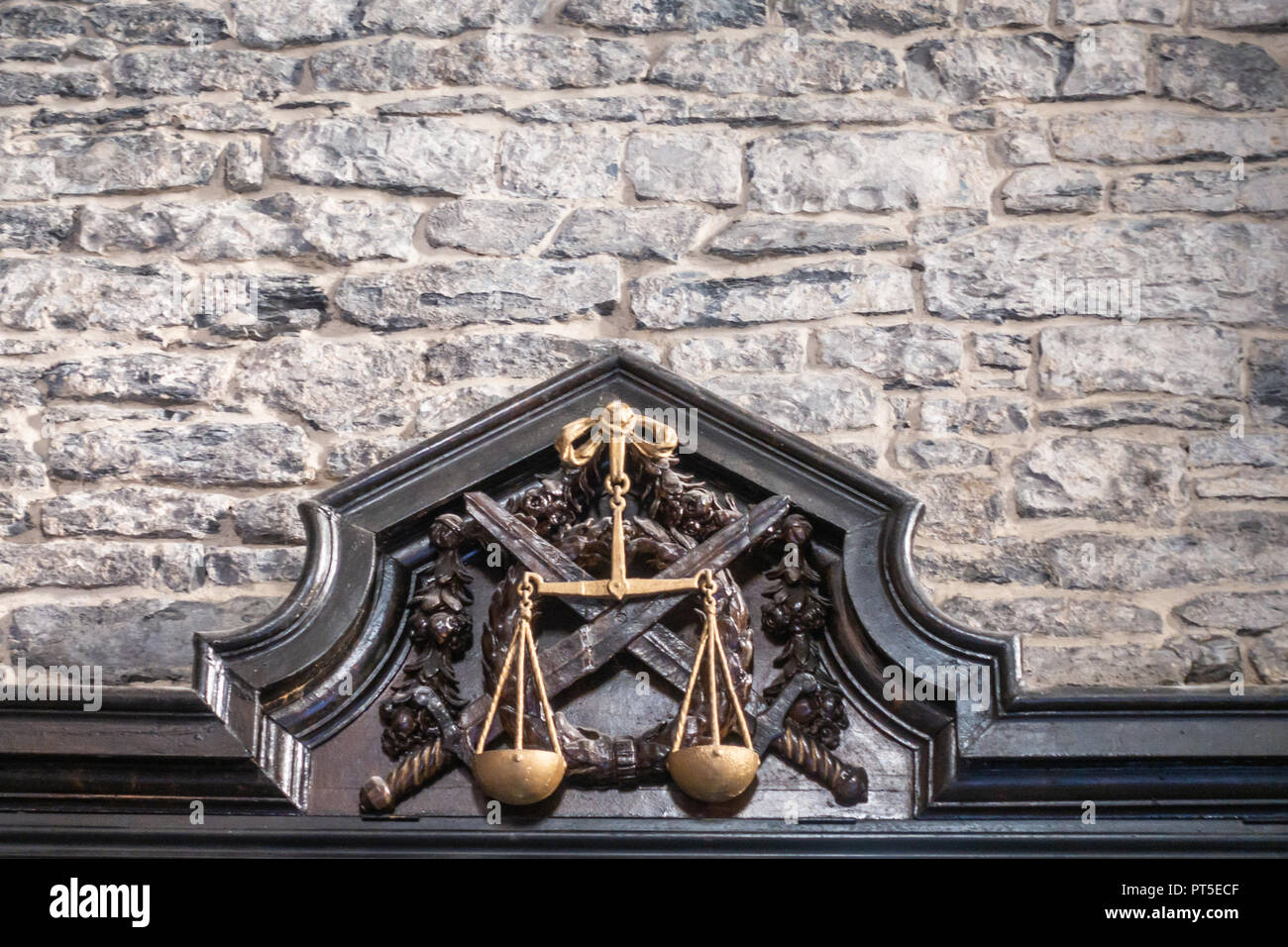 Ghent, Belgium - September 23, 2018: Balance symbol as Justice is enforced  by the swords as seen in Gent Gravensteen Castle. Gray stone wall with blac  Stock Photo - Alamy
