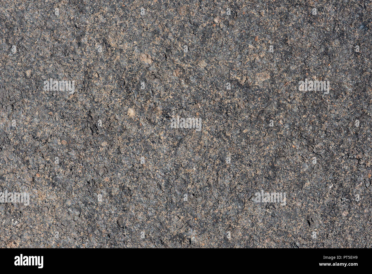 Close up macro view of light gray rough volcanic stone surface ...