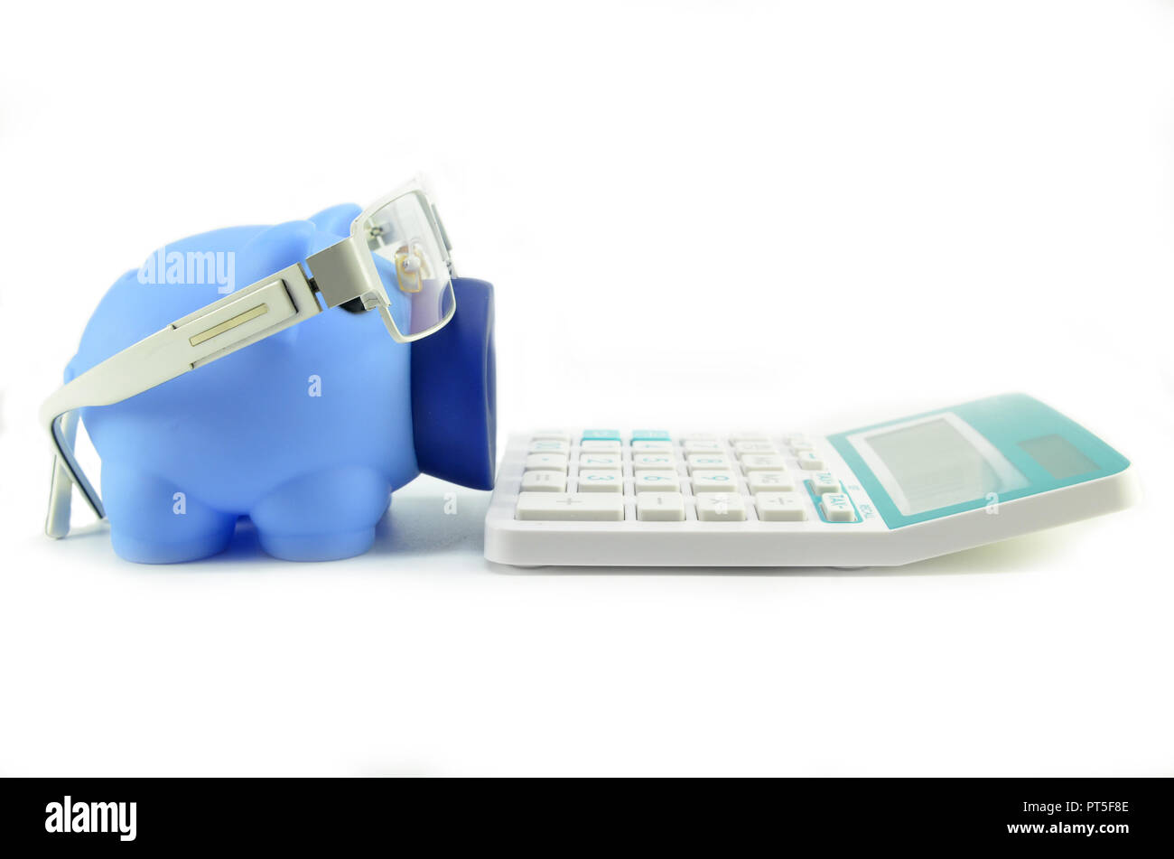 Piggy bank with eye glasses and calculator isolated on white background ...