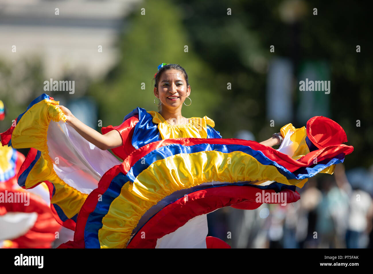 Washington, D.C., USA - September 29, 2018: The Fiesta DC Parade, Young women wearing traditional ecuadorian clothing dancing Stock Photo