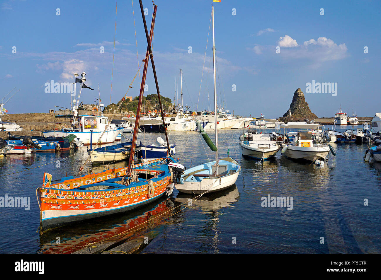 Colourful painted fishing boat at harbour of fishing village Aci Trezza, comune of Aci Castello, Catania, Sicily, Italy Stock Photo