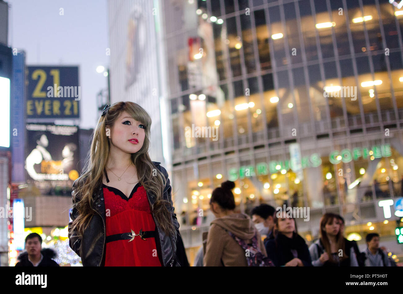 Japanese Girl poses on the street in Shibuya, Japan. Shibuya is a town ...