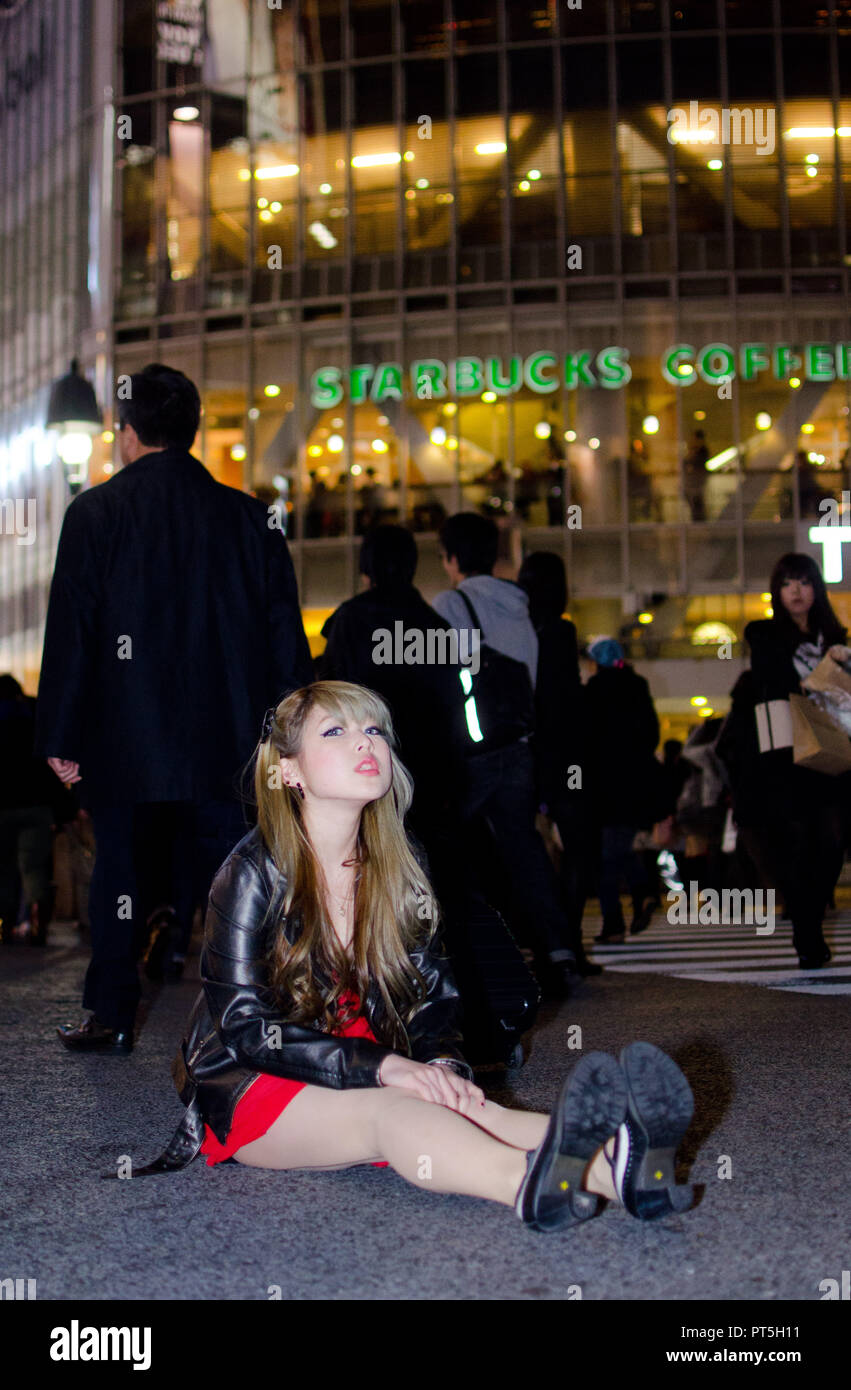 Japanese Girl poses on the street in Shibuya, Japan. Shibuya is a town ...
