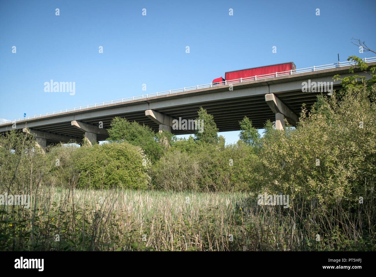 M56 Motorway passing over marshes between River Weaver and the Weaver Navigation, Frodsham, Cheshire, UK. Stock Photo