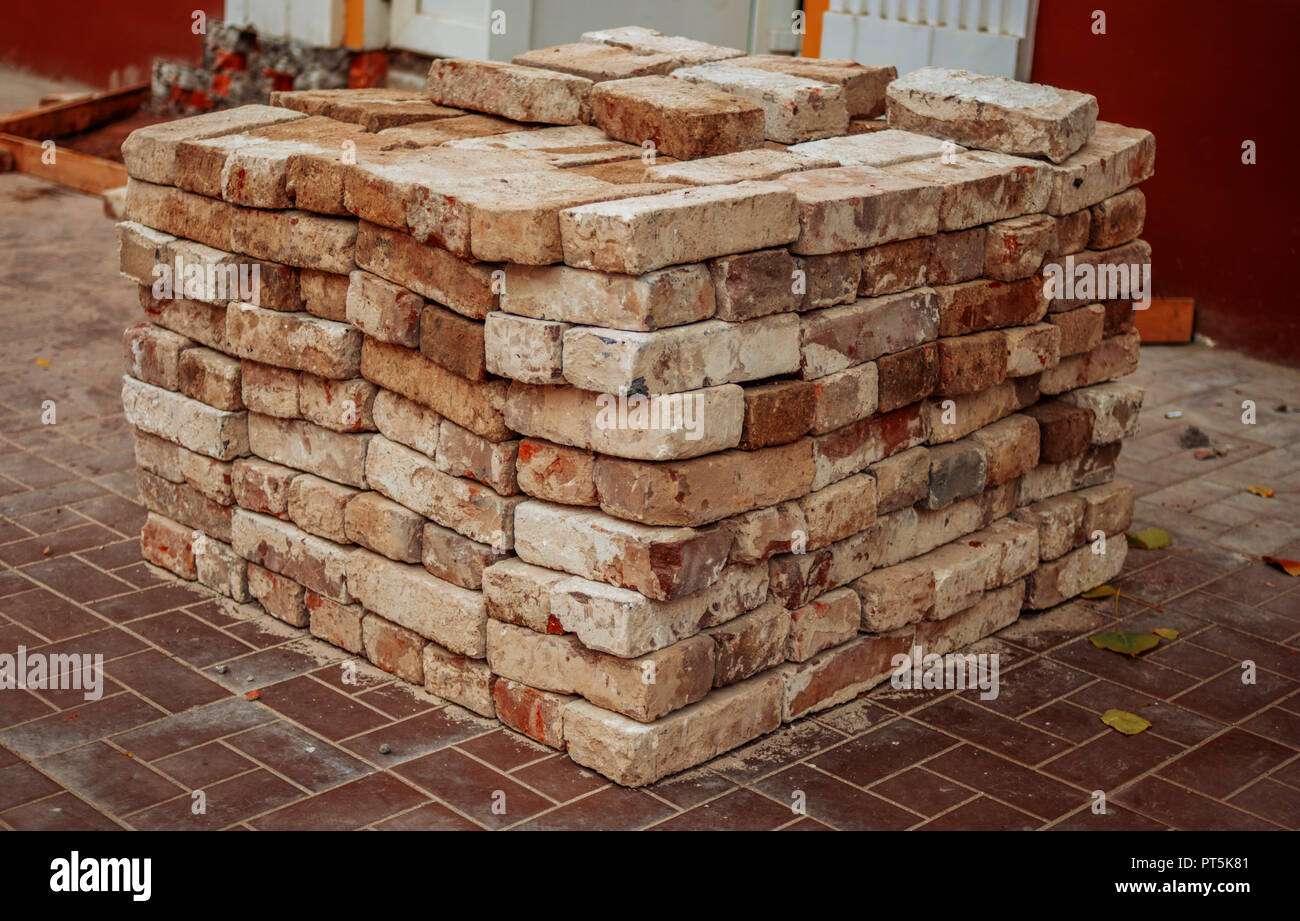 Recicling of red bricks. Old used redbricks ready to another use Stock