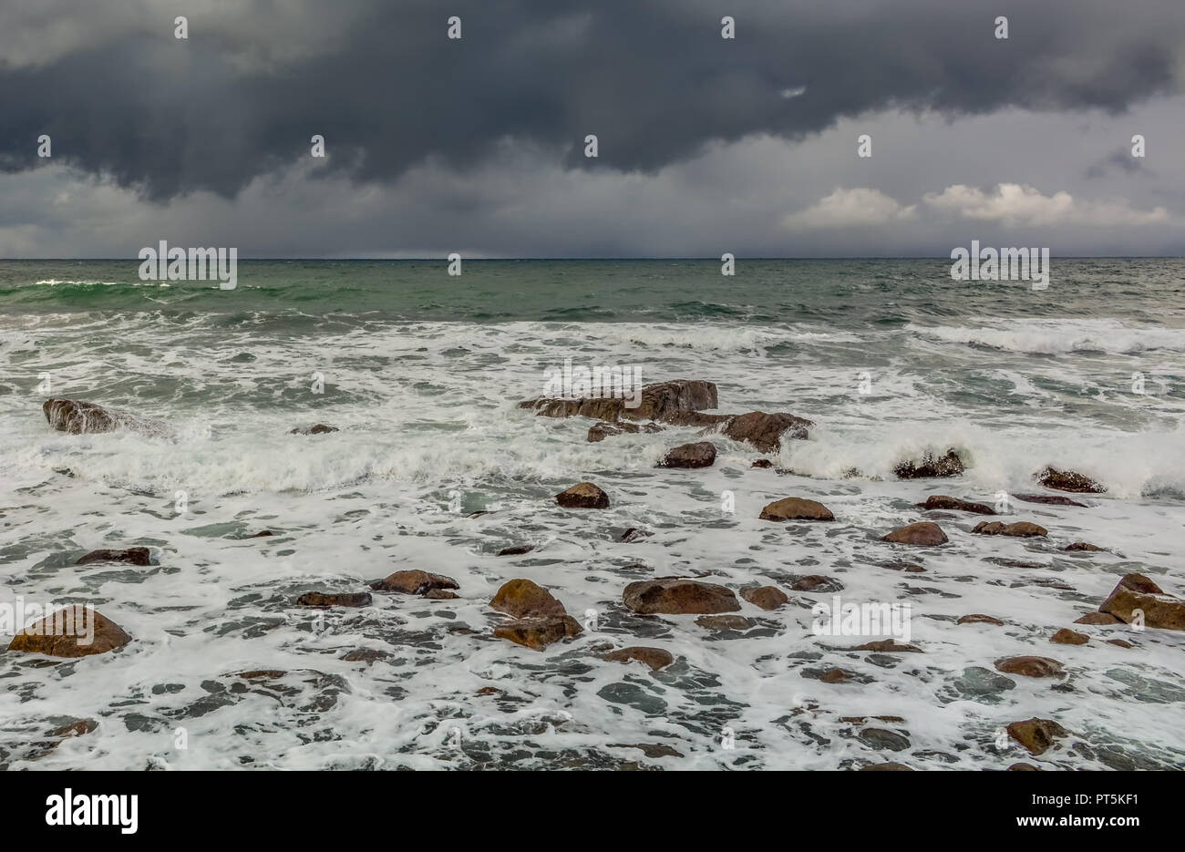 Looking out to the Japan Sea with distant rain on the horizon, from Marine Town, Wajima, Ishikawa Prefecture, Japan. Stock Photo