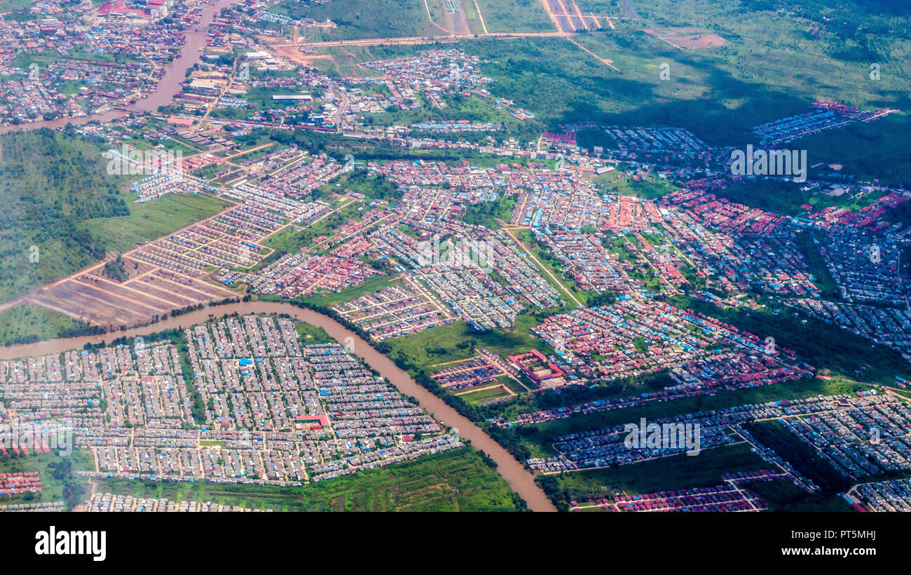 Aerial Picture Of Dense Population Neighborhood Split By The River 
