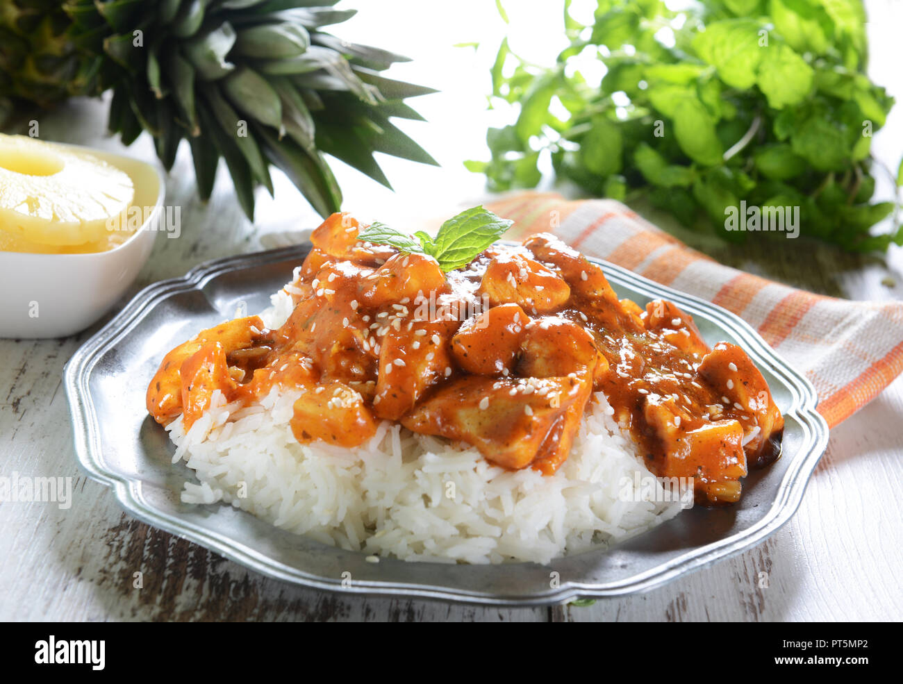 Chicken in caribbean style with pineapple and rice Stock Photo Alamy