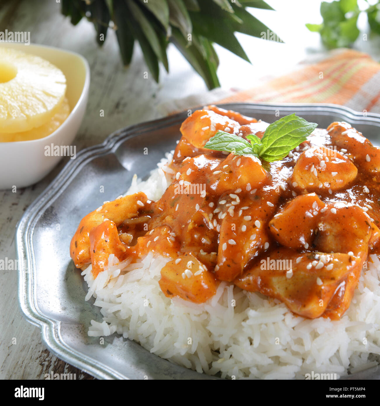 Chicken in caribbean style with pineapple and rice Stock Photo Alamy