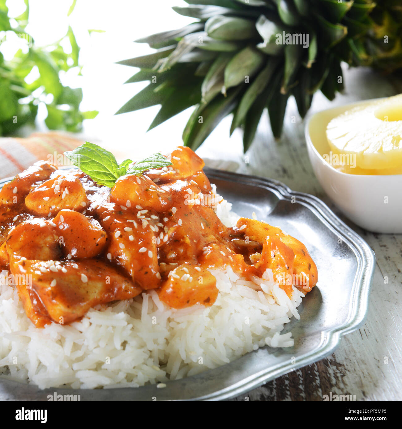 Chicken in caribbean style with pineapple and rice Stock Photo Alamy