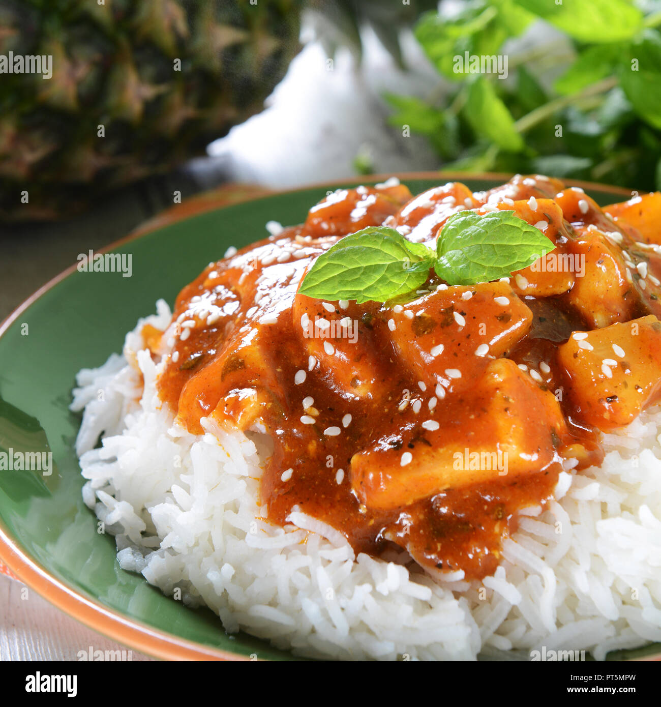 Chicken in caribbean style with pineapple and rice Stock Photo Alamy