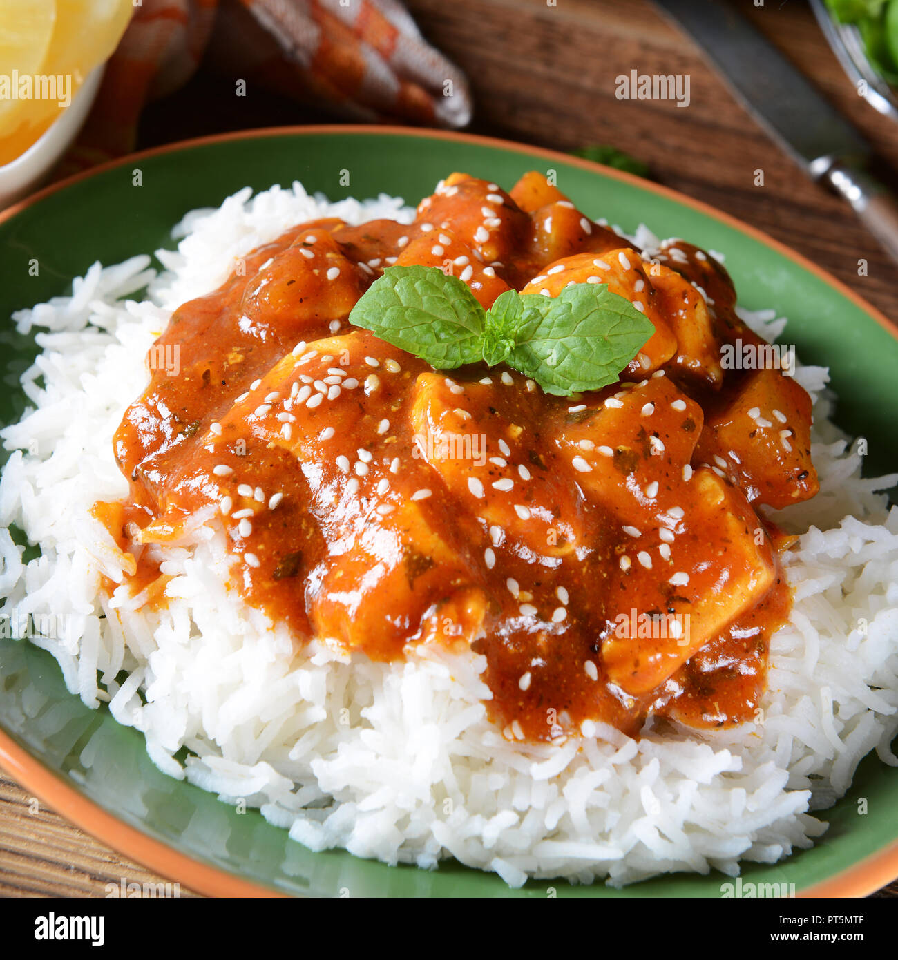 Chicken in caribbean style with pineapple and rice Stock Photo Alamy