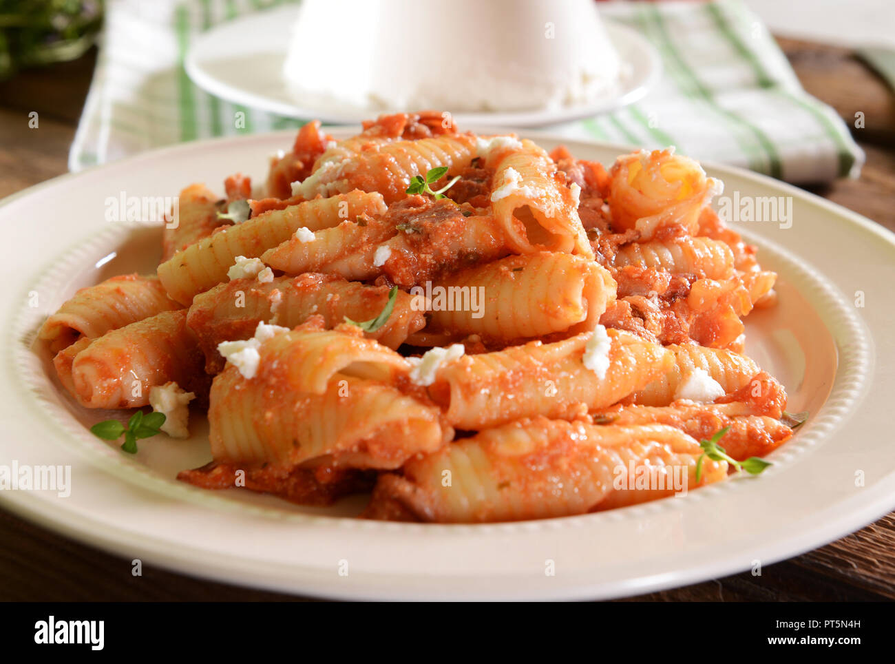 Pasta with ricotta sauce, tomatoes and ham Stock Photo Alamy