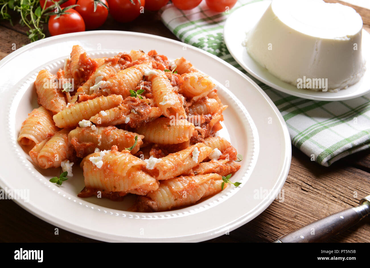 Pasta with ricotta sauce, tomatoes and ham Stock Photo Alamy