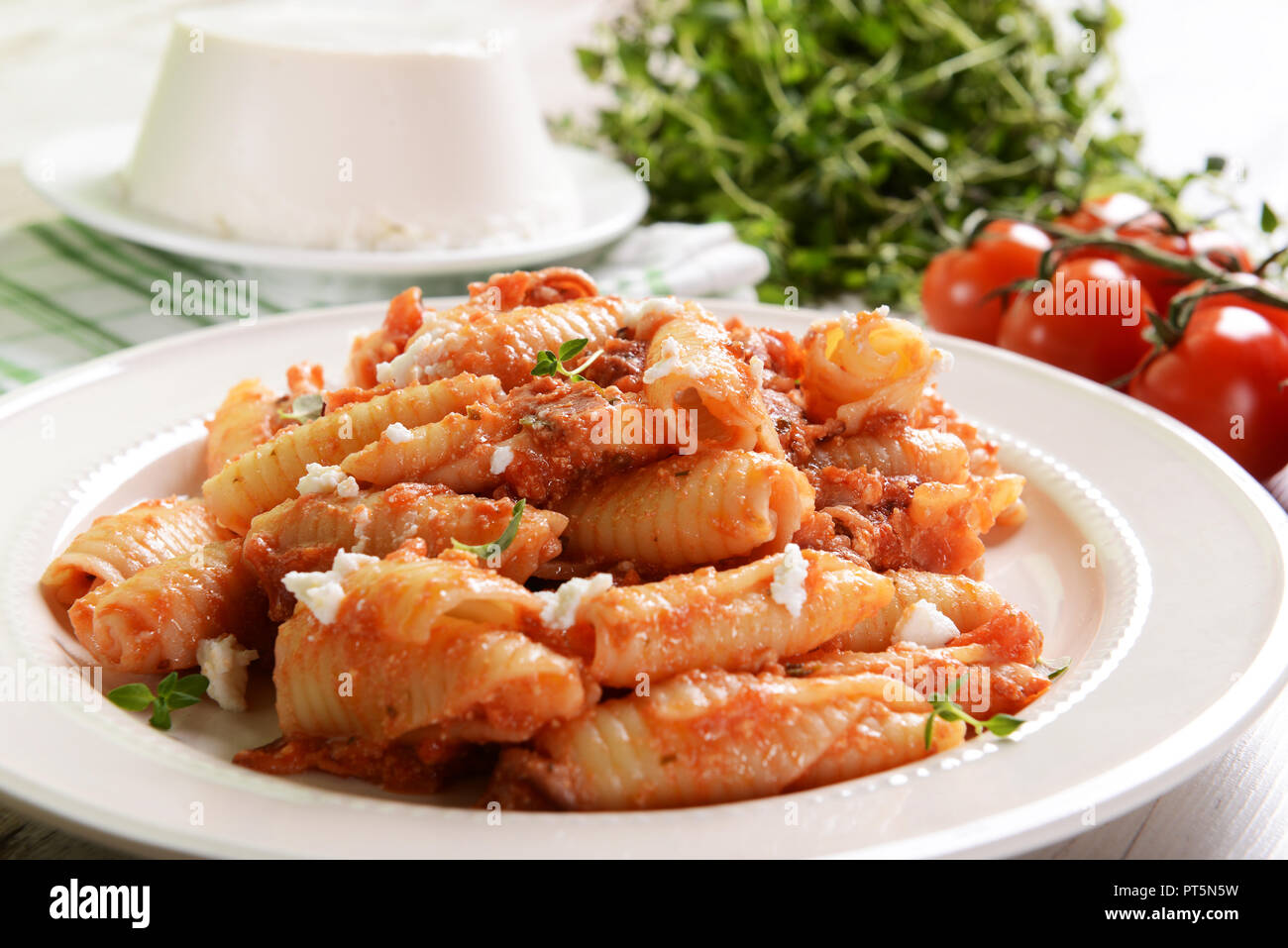 Pasta with ricotta sauce, tomatoes and ham Stock Photo Alamy